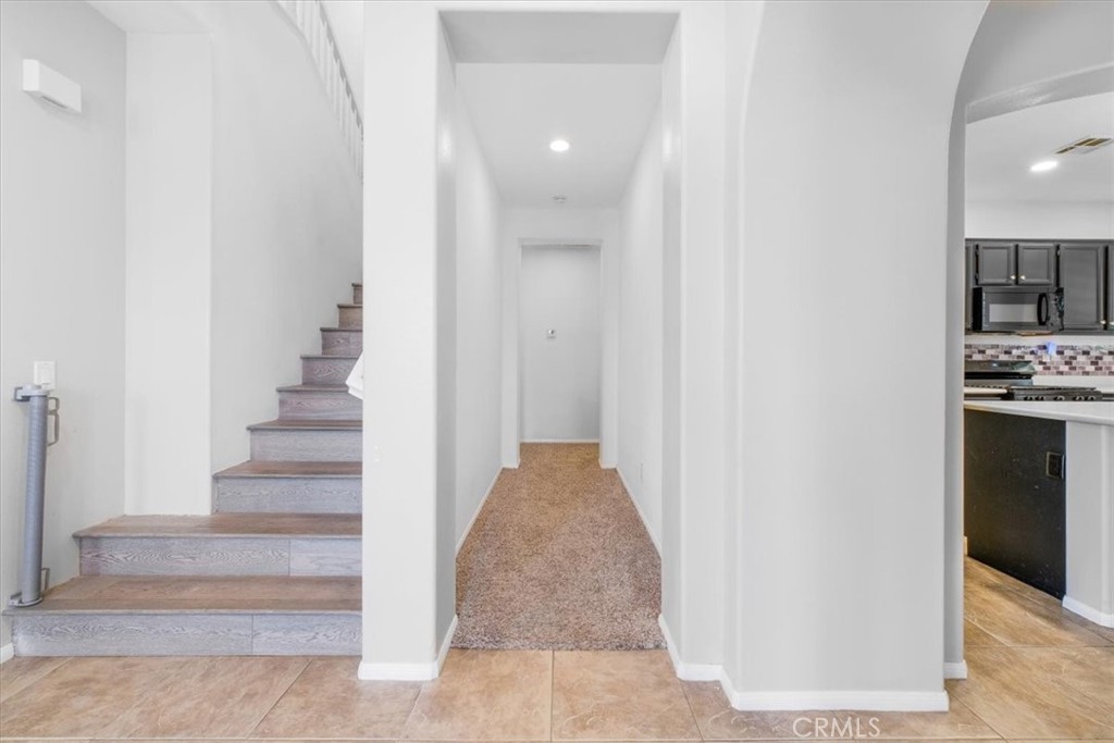 40530 Amador Drive Indio, CA 92203 - Photo 28 of 59 a view of a hallway with wooden floor and entryway