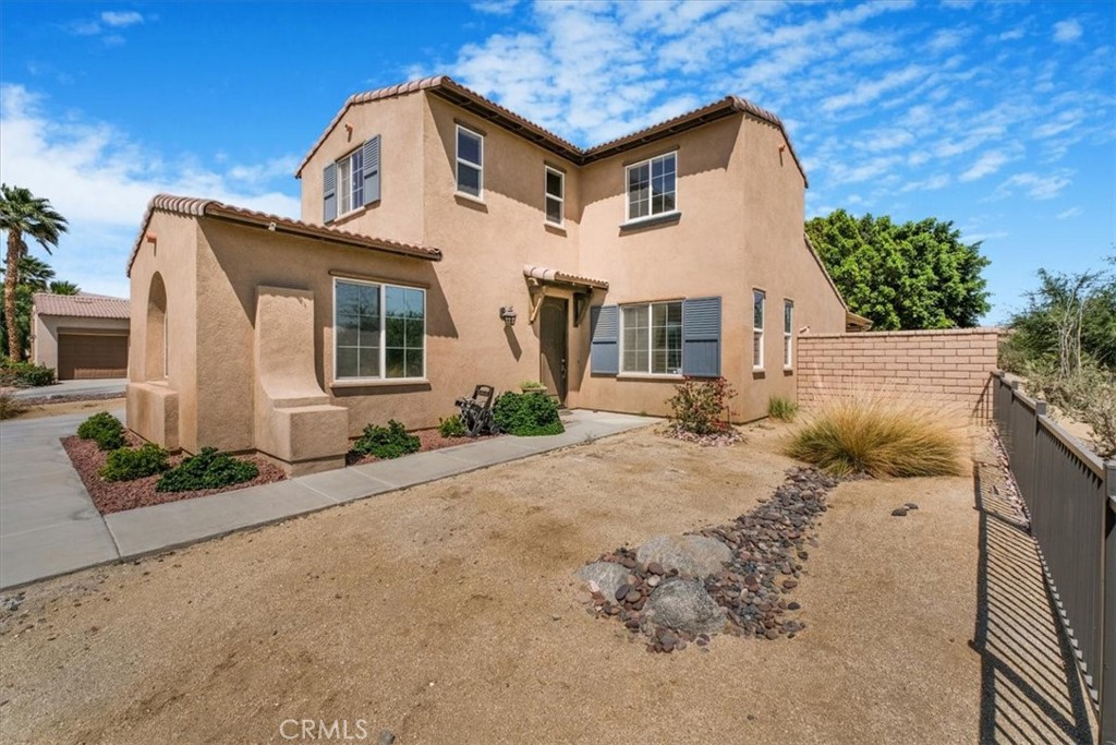 40530 Amador Drive Indio, CA 92203 - Photo 3 of 59 a front view of a house with a yard