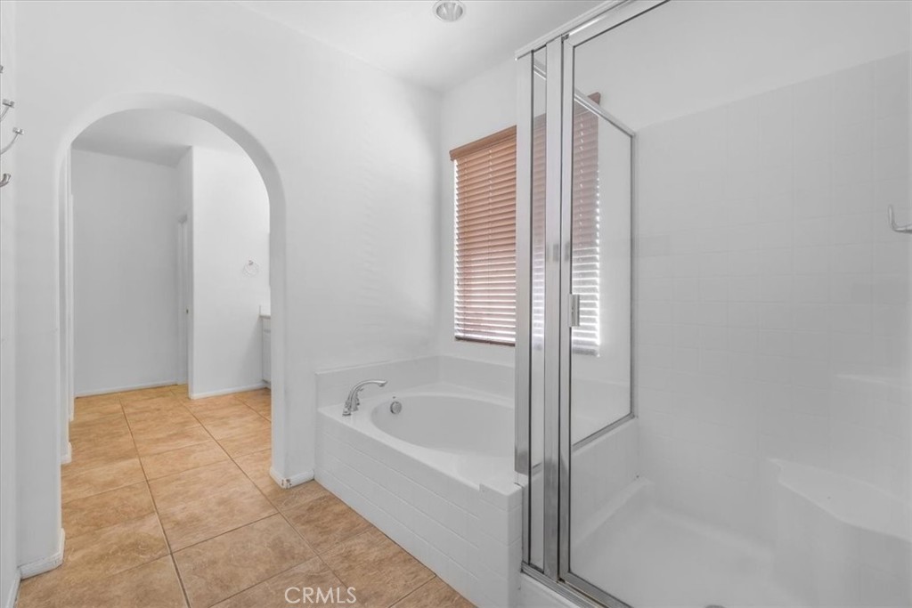 40530 Amador Drive Indio, CA 92203 - Photo 35 of 59 a bathroom with a bathtub and a shower