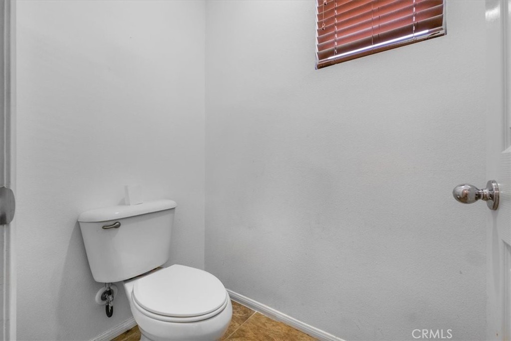 40530 Amador Drive Indio, CA 92203 - Photo 37 of 59 a white toilet sitting next to a white wall