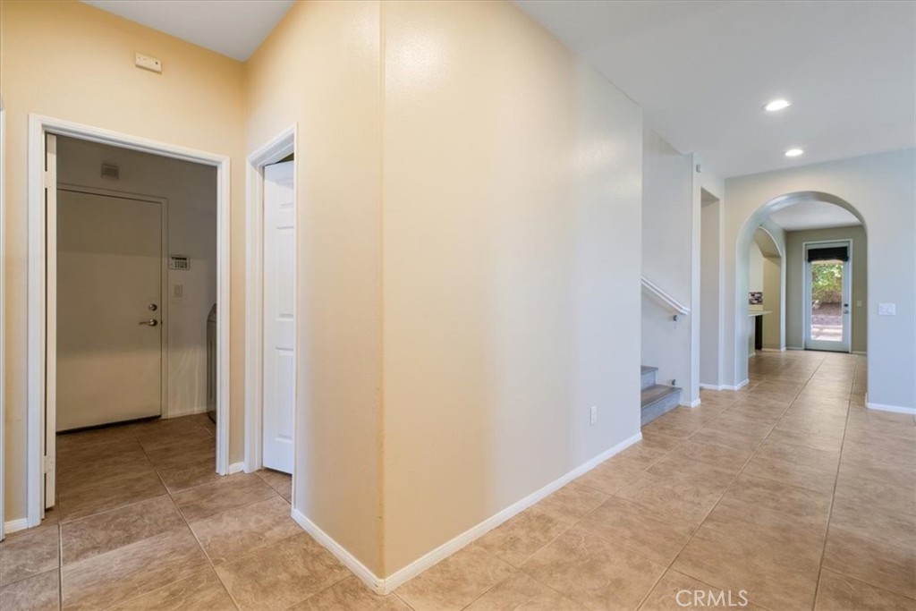 40530 Amador Drive Indio, CA 92203 - Photo 4 of 59 a view of a hallway with wooden floor and closet