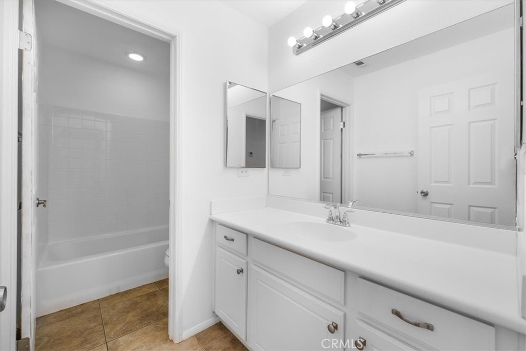 40530 Amador Drive Indio, CA 92203 - Photo 46 of 59 a bathroom with a sink a tub and a mirror