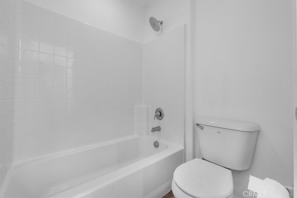 40530 Amador Drive Indio, CA 92203 - Photo 47 of 59 a white toilet and tub next to a bathroom sink