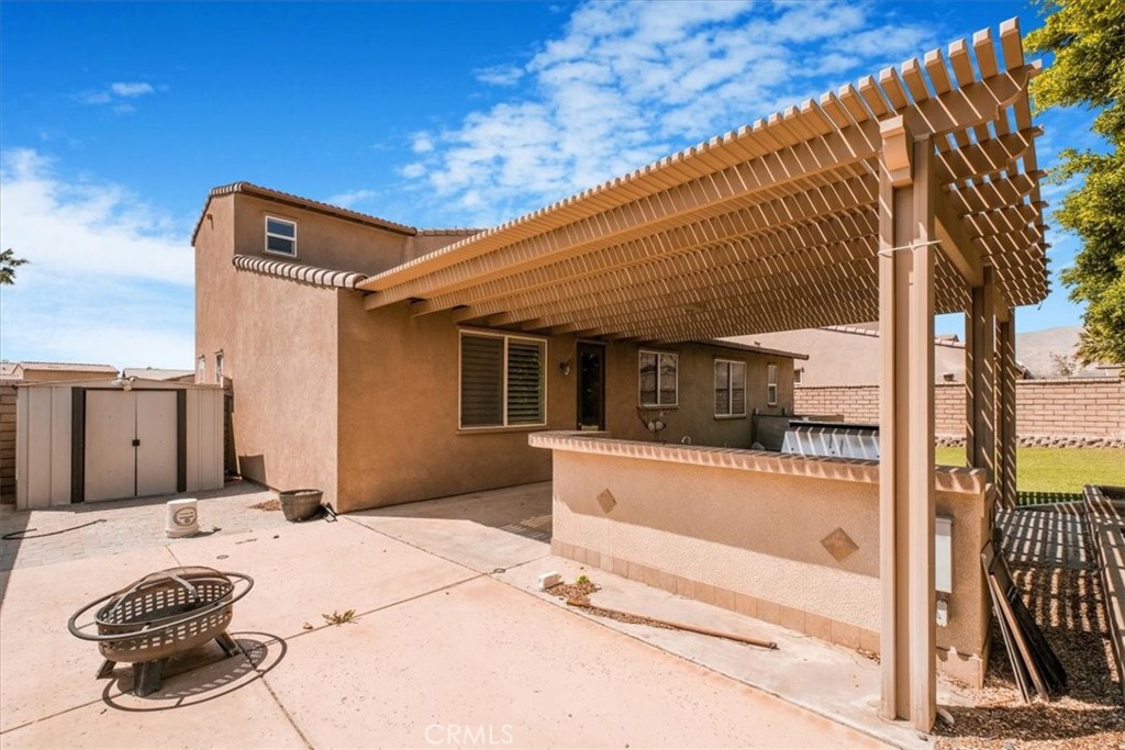 40530 Amador Drive Indio, CA 92203 - Photo 52 of 59 a front view of a house with swimming pool
