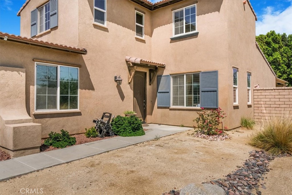 40530 Amador Drive Indio, CA 92203 - Photo 58 of 59 front view of a brick house with a yard