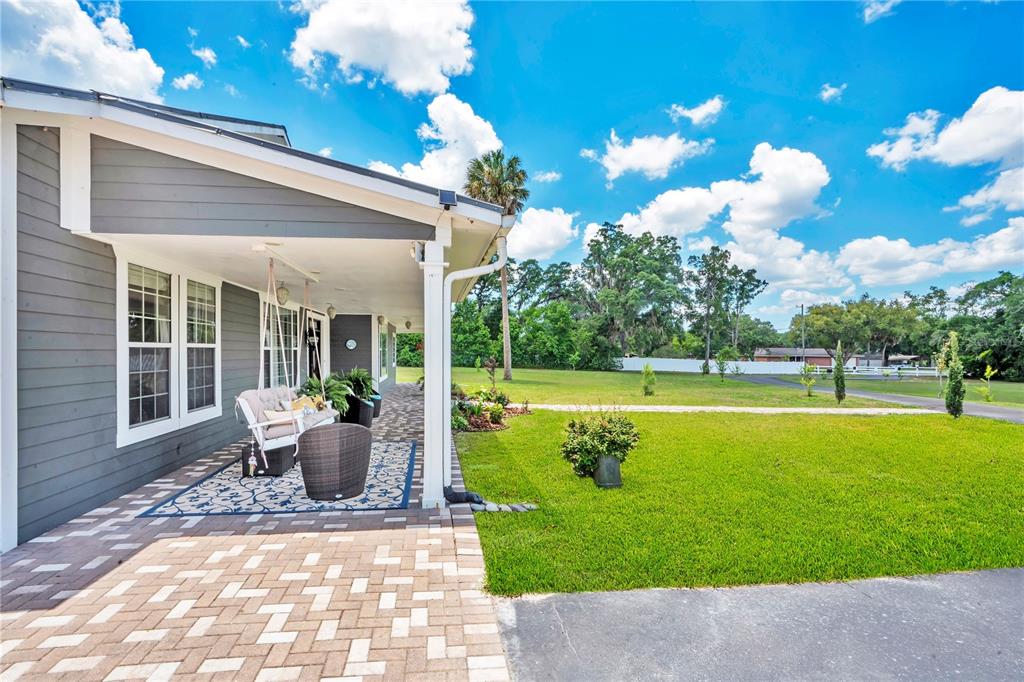 5785 Gilliam Road Orlando, FL 32818 - Photo 8 of 100 a view of a house with a swimming pool and sitting area