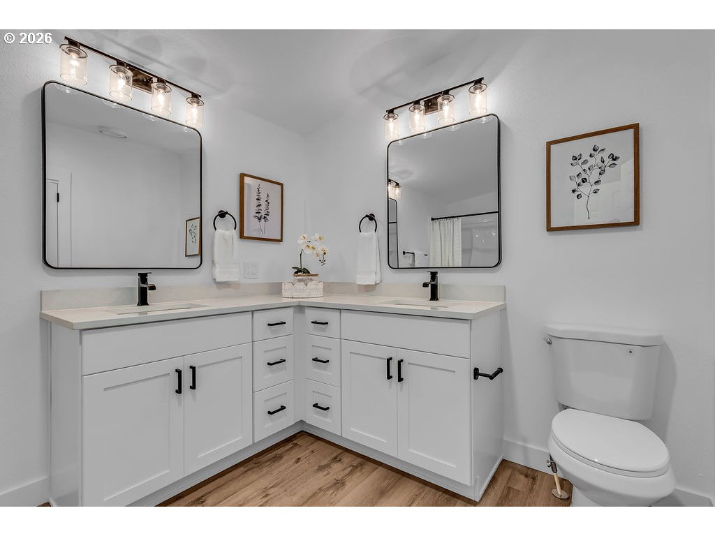 241 Northwest Wade Street Estacada, OR 97023 - Photo 22 of 45 a bathroom with a toilet sink and mirror