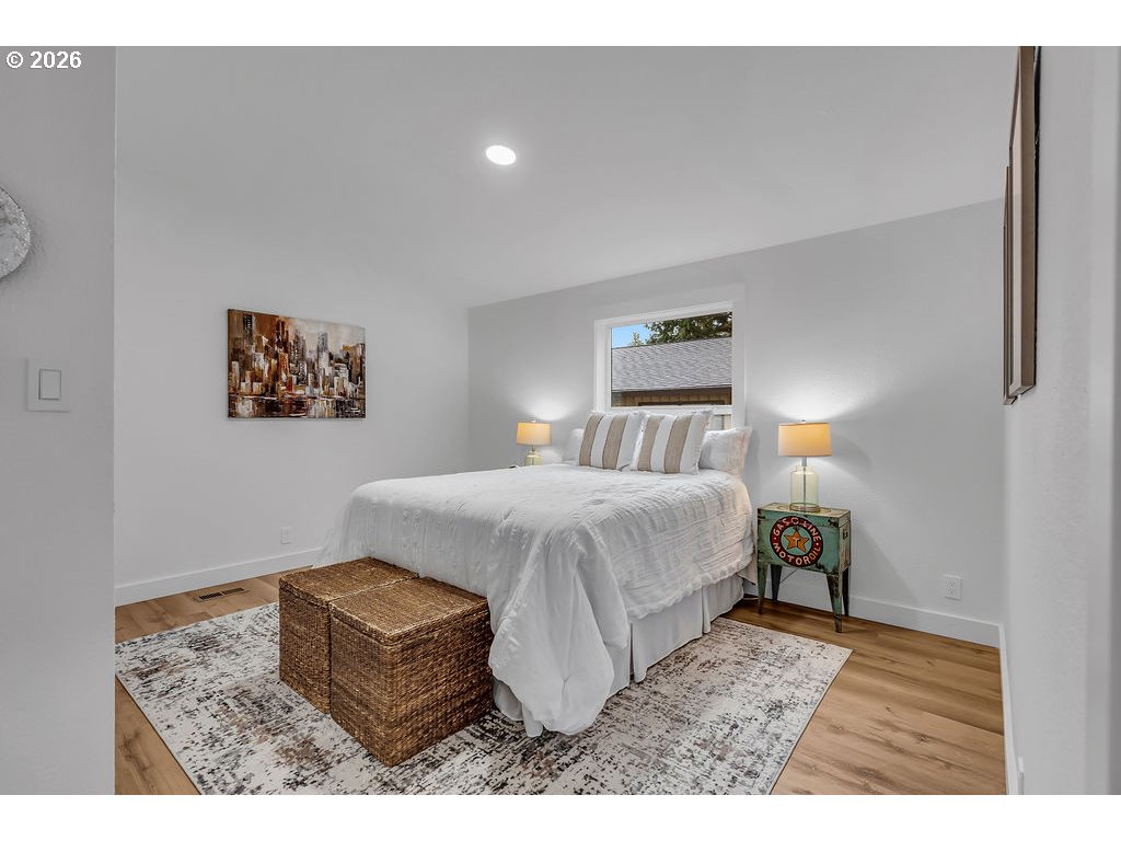 241 Northwest Wade Street Estacada, OR 97023 - Photo 24 of 45 a bedroom with a bed and a painting on the wall