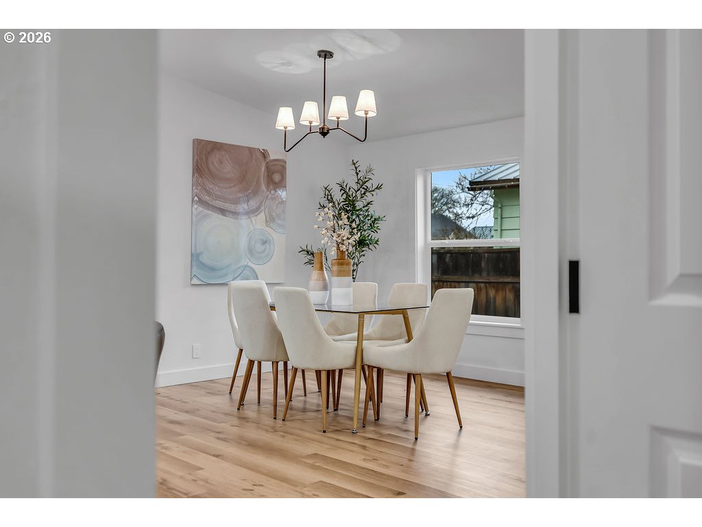 241 Northwest Wade Street Estacada, OR 97023 - Photo 32 of 45 a view of a dining room with furniture and chandelier