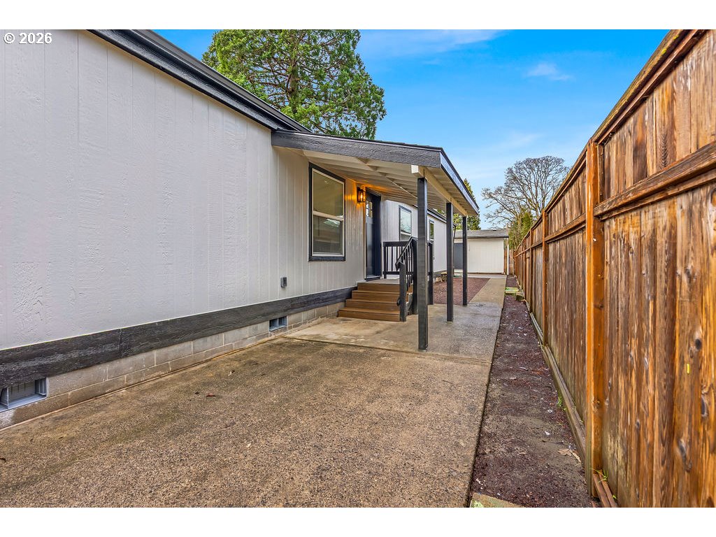 241 Northwest Wade Street Estacada, OR 97023 - Photo 41 of 45 a view of a backyard with wooden fence