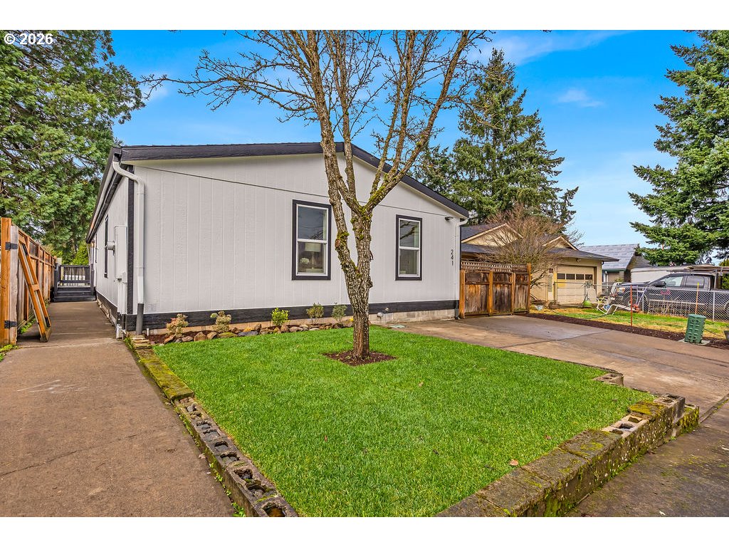 241 Northwest Wade Street Estacada, OR 97023 - Photo 6 of 45 a house with garden in front of it