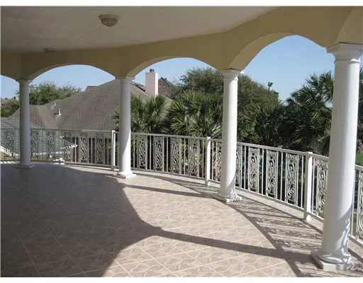 a view of a two chairs next to a yard