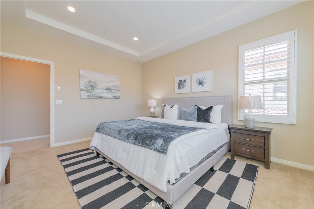 93 Rembrandt Irvine, CA 92620 - Photo 14 of 26 a bedroom with a bed and a painting on the wall