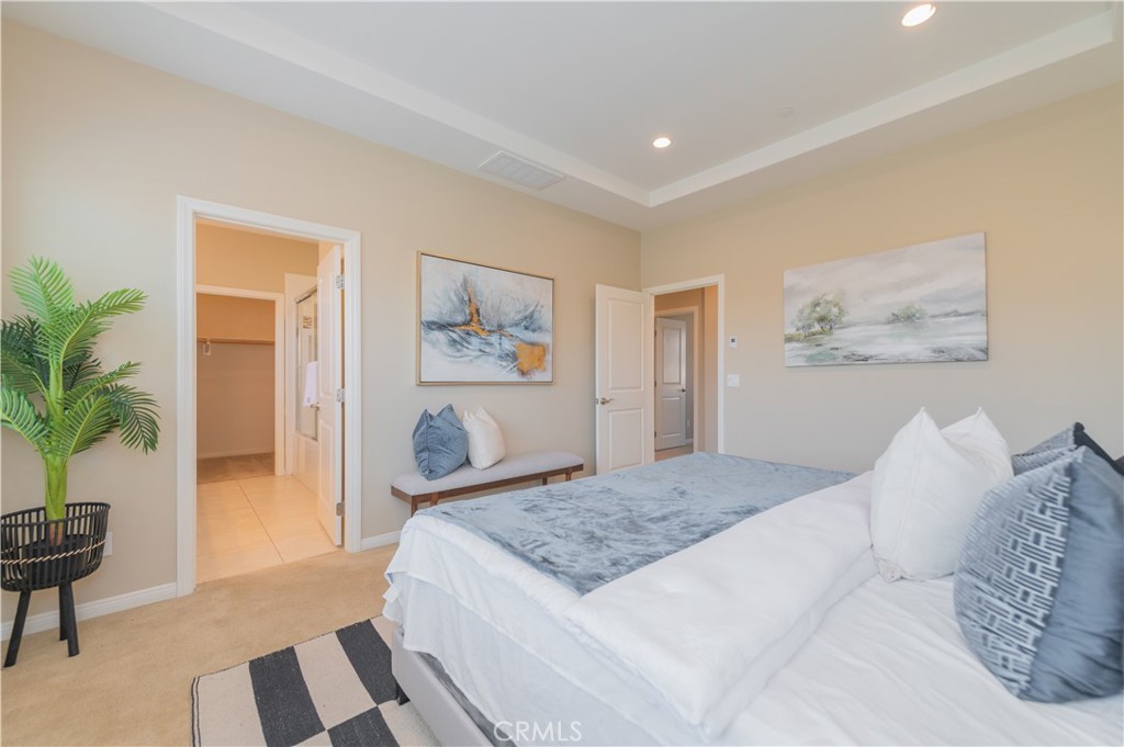 93 Rembrandt Irvine, CA 92620 - Photo 15 of 26 a bedroom with a large bed and a couch