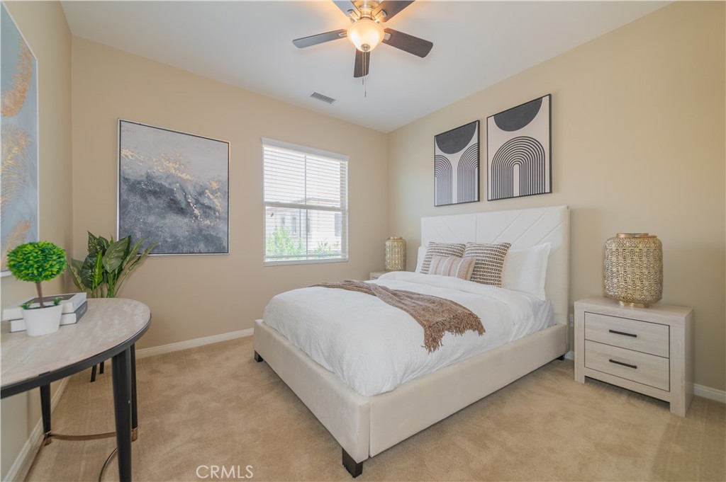93 Rembrandt Irvine, CA 92620 - Photo 16 of 26 a bedroom with a large bed and a chandelier