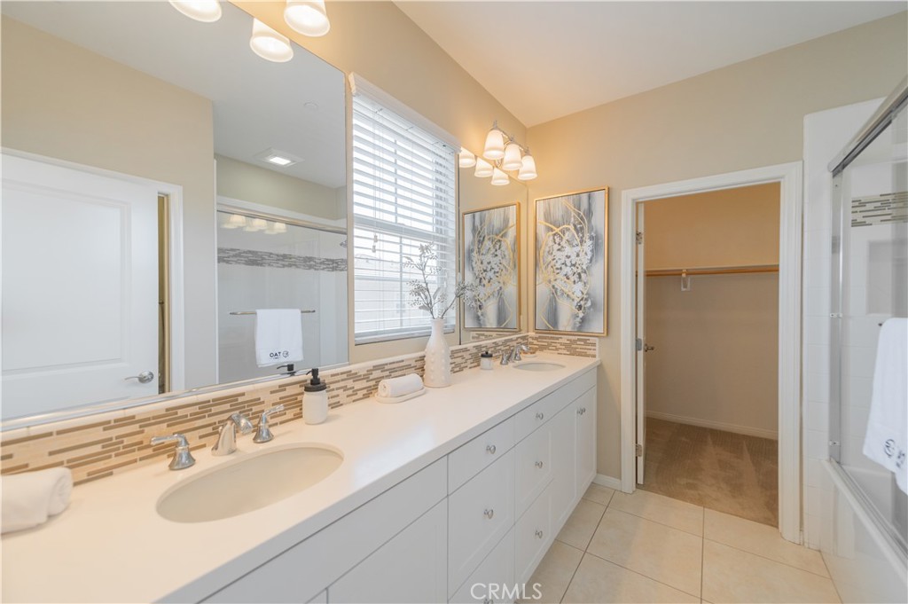 93 Rembrandt Irvine, CA 92620 - Photo 18 of 26 a bathroom with a sink double vanity and a mirror