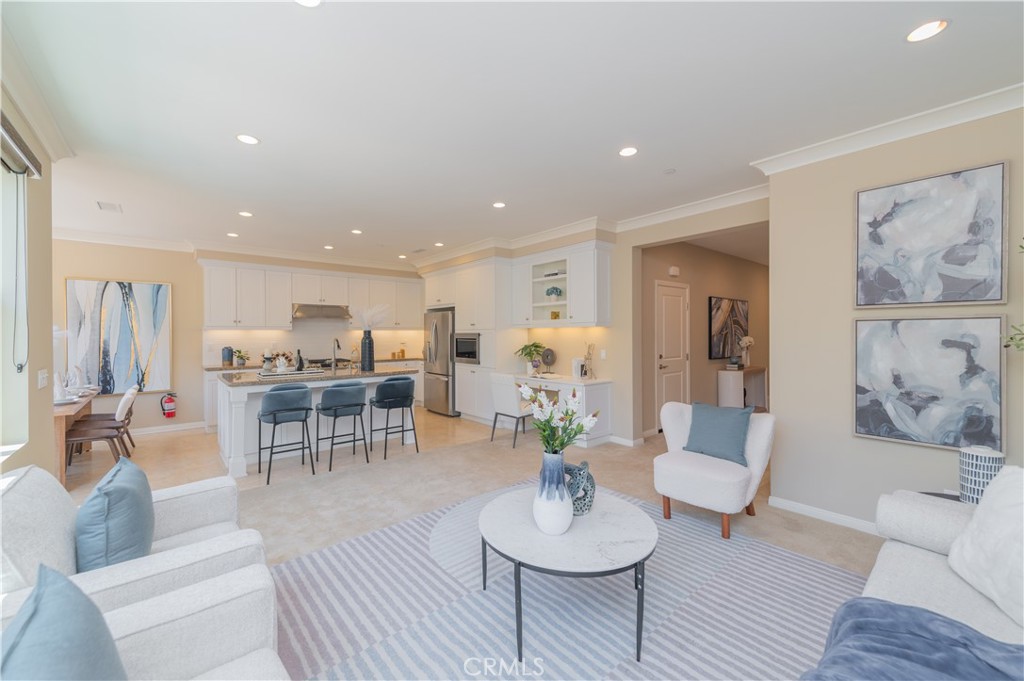 93 Rembrandt Irvine, CA 92620 - Photo 4 of 26 a living room with furniture and kitchen view