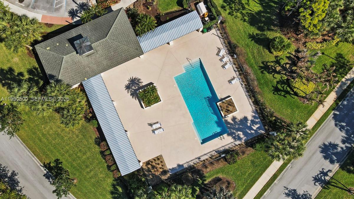 337 Southwest Maclay Way Port St. Lucie, FL 34986 - Photo 8 of 44 an aerial view of a house with a yard and potted plants