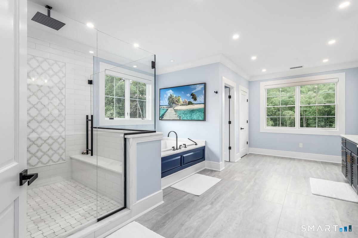2 Pond View Lane Sherman, CT 06784 - Photo 22 of 40 a bathroom with a tub sink and mirror
