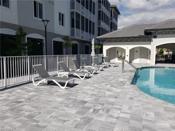 a view of a patio with a table and chairs