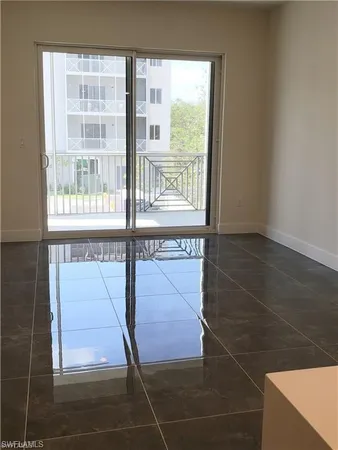 a bathroom with a sink a toilet a mirror and shower