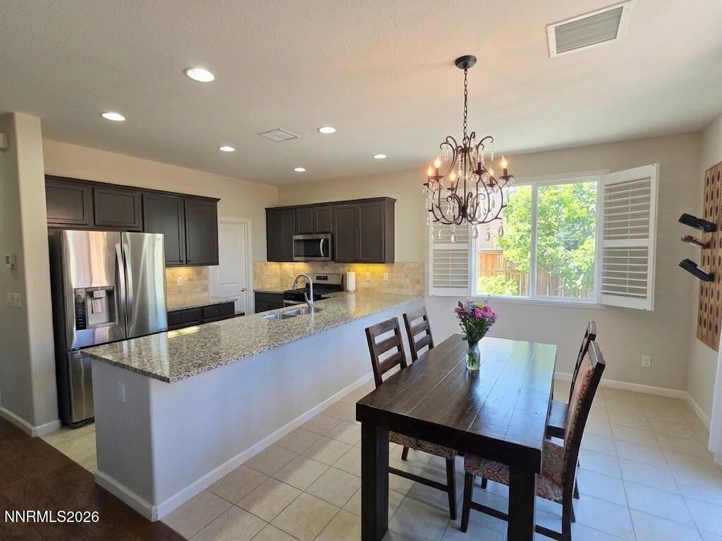 2775 Bonfire Lane Reno, NV 89521 - Photo 17 of 41 a view of a dining room with furniture window and outside view
