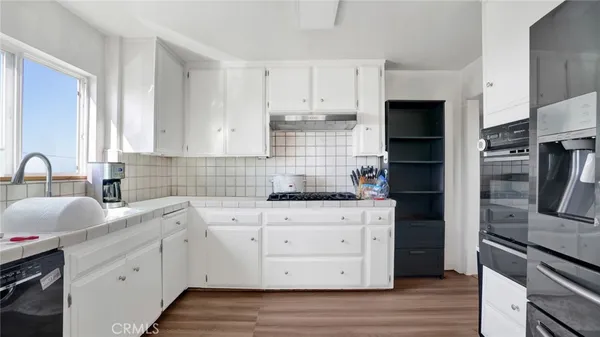 a view of a livingroom with furniture and a window