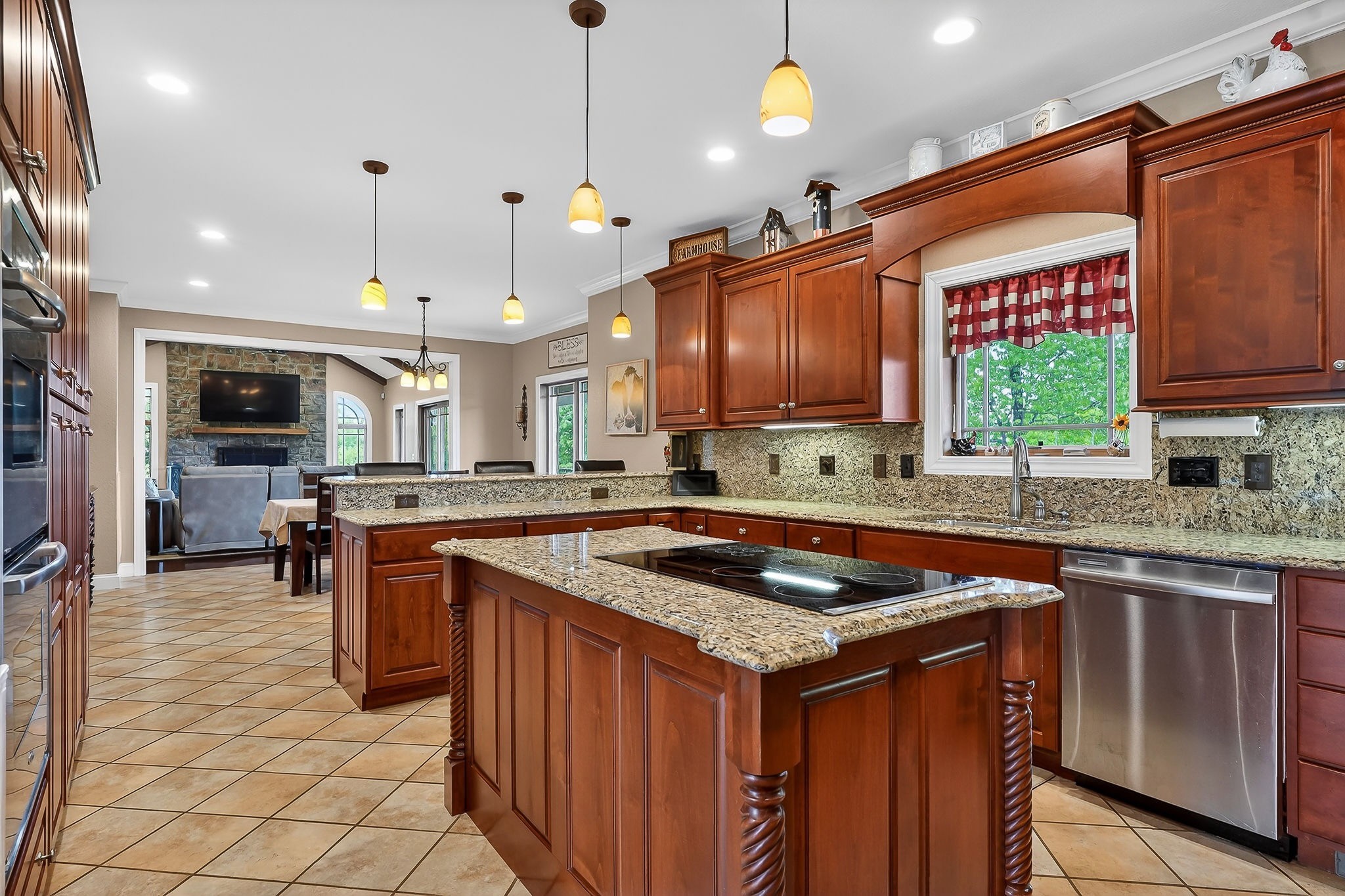 933 John Henry Lewis Road Dunlap, TN 37327 - Photo 26 of 100 a kitchen with stainless steel appliances granite countertop a sink a stove and a wooden cabinets