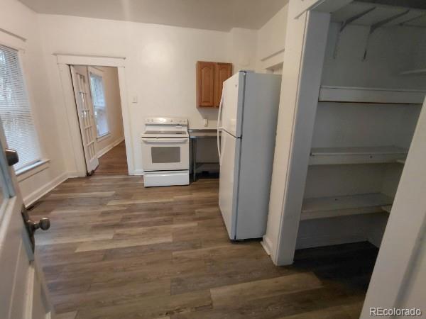 1917 South Fox Street Denver, CO 80223 - Photo 5 of 10 a kitchen with a refrigerator and a stove