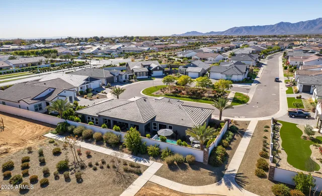 a view of a terrace with furniture and a garden