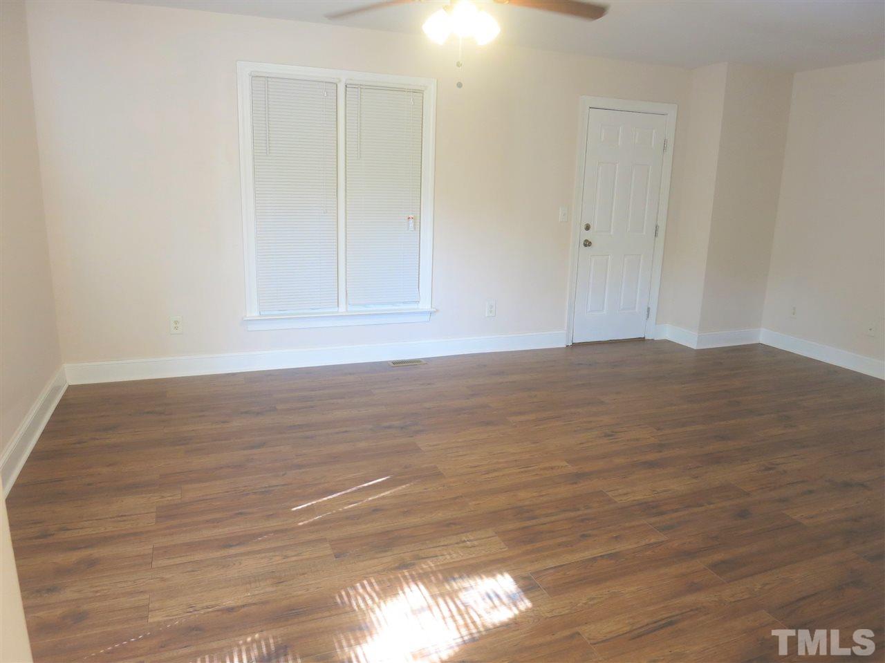 509 Brent Road Raleigh, NC 27606 - Photo 5 of 9 a view of an empty room with wooden floor