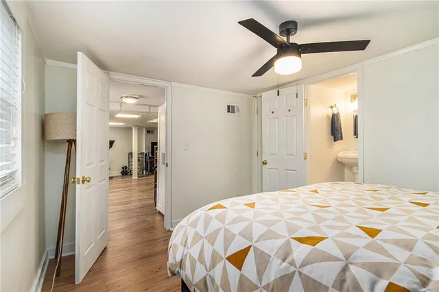 a bedroom with a bed and a mirror