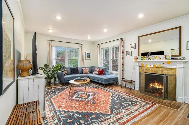 a living room with furniture and a fireplace