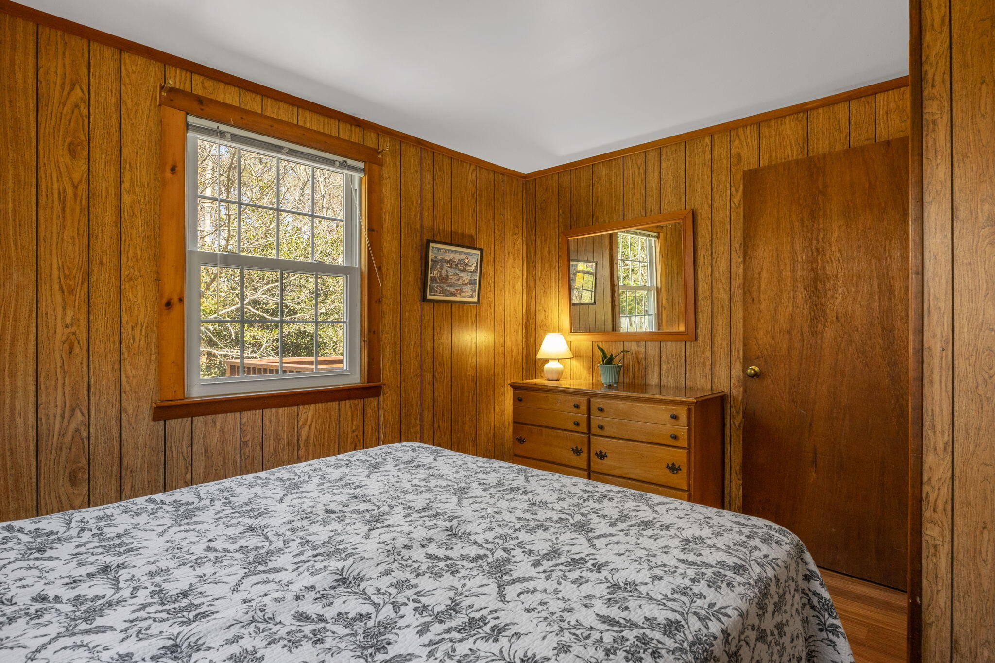 60 Long Avenue, Unit A Wellfleet, MA 02667 - Photo 17 of 28 a bedroom with a bed and wooden floor