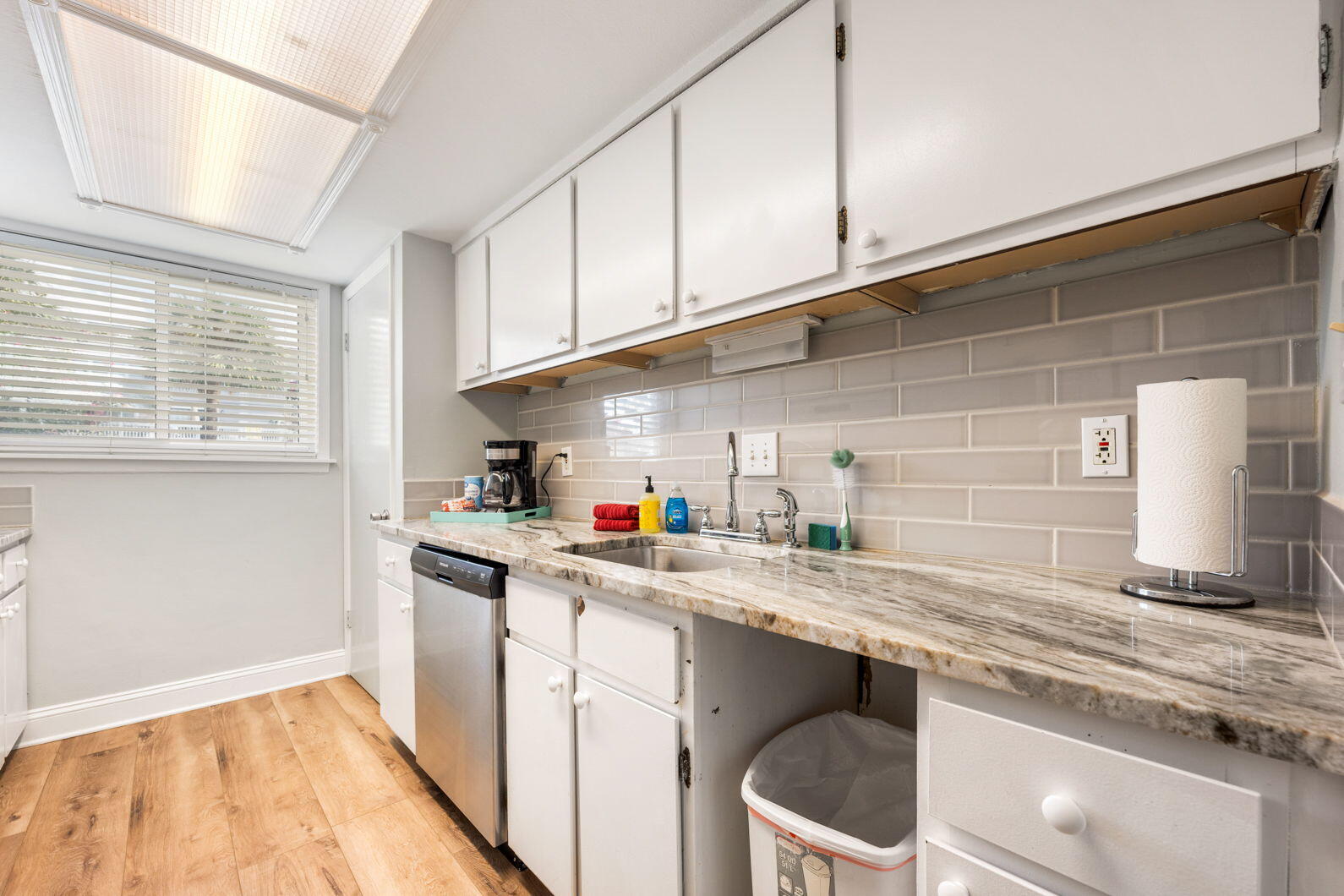940 Highway 98, Unit 31 Destin, FL 32541 - Photo 12 of 36 a kitchen with a sink cabinets and window