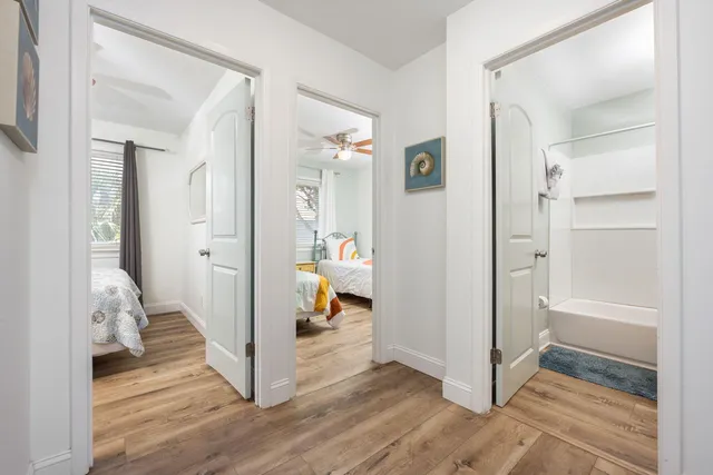 a view of living room and wooden floor