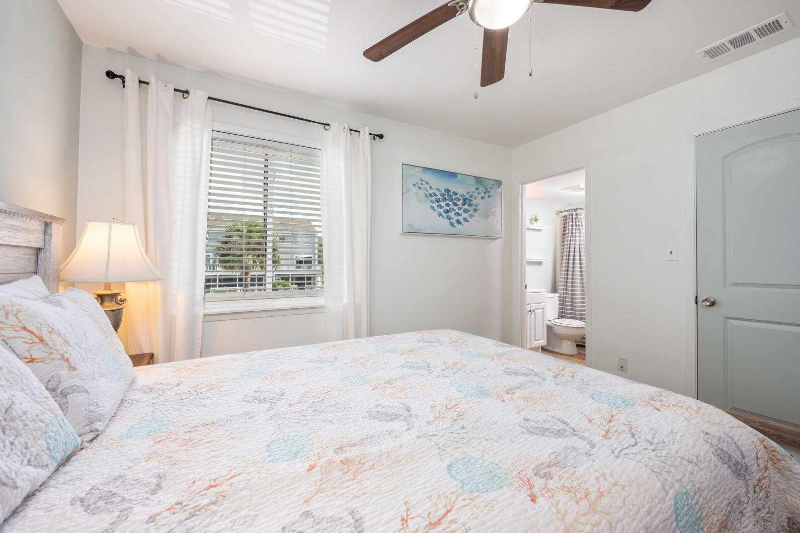 940 Highway 98, Unit 31 Destin, FL 32541 - Photo 20 of 36 a bedroom with a large bed and a window