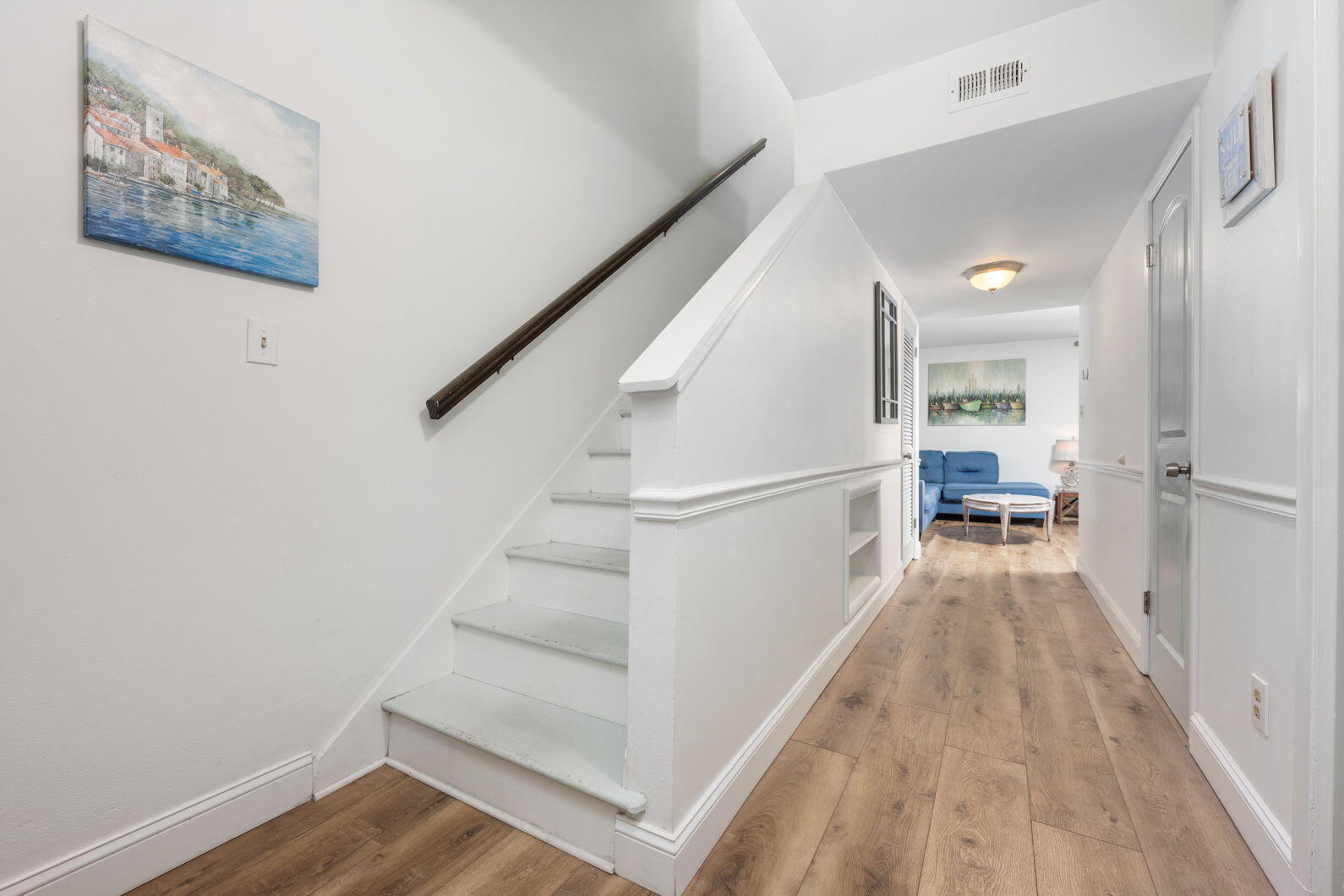 940 Highway 98, Unit 31 Destin, FL 32541 - Photo 2 of 36 a view of a hallway with wooden floor and staircase