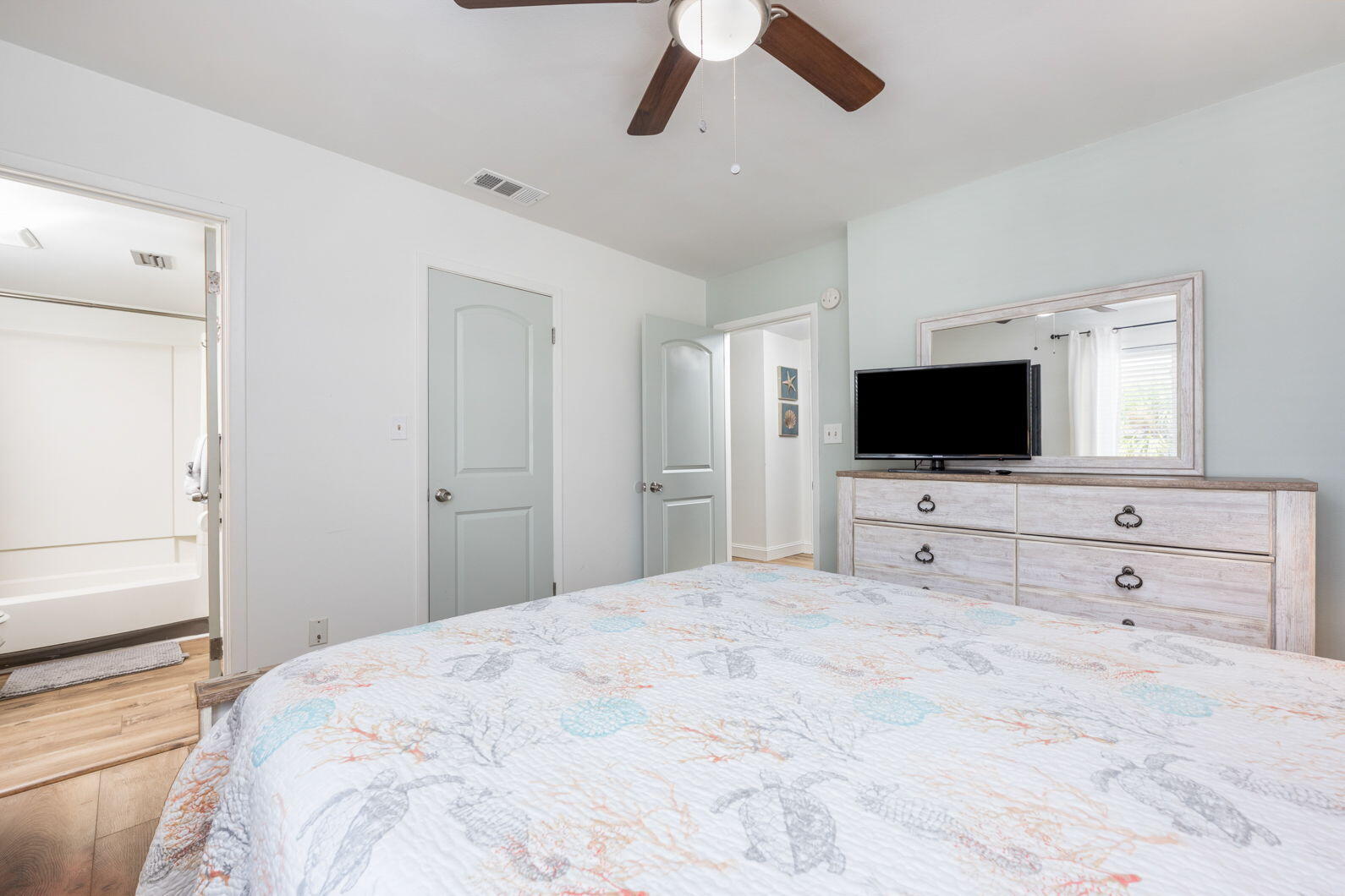 940 Highway 98, Unit 31 Destin, FL 32541 - Photo 22 of 36 a bedroom with a flat screen tv and a bed