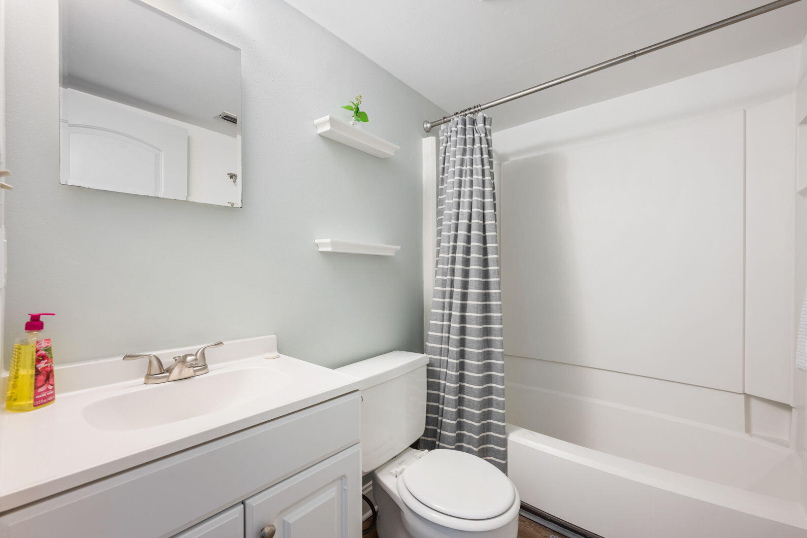 940 Highway 98, Unit 31 Destin, FL 32541 - Photo 23 of 36 a bathroom with a sink toilet and shower