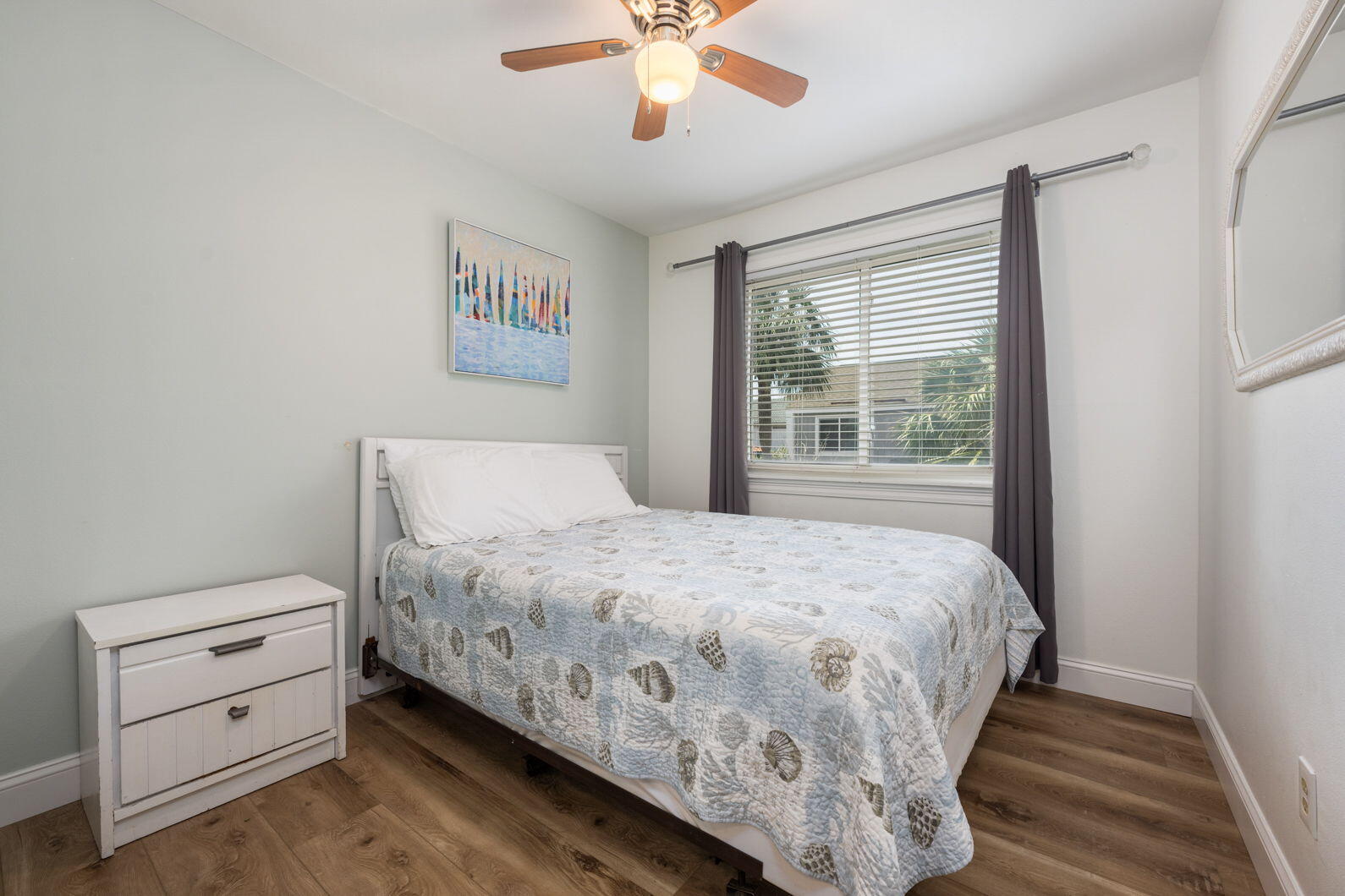940 Highway 98, Unit 31 Destin, FL 32541 - Photo 26 of 36 a bedroom with a bed and a window