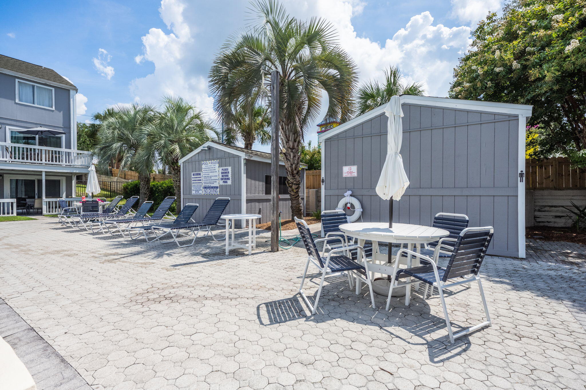 940 Highway 98, Unit 31 Destin, FL 32541 - Photo 31 of 36 a view of a dinning table and chairs in backyard of the house