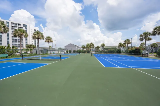 a view of an outdoor space and tennis court