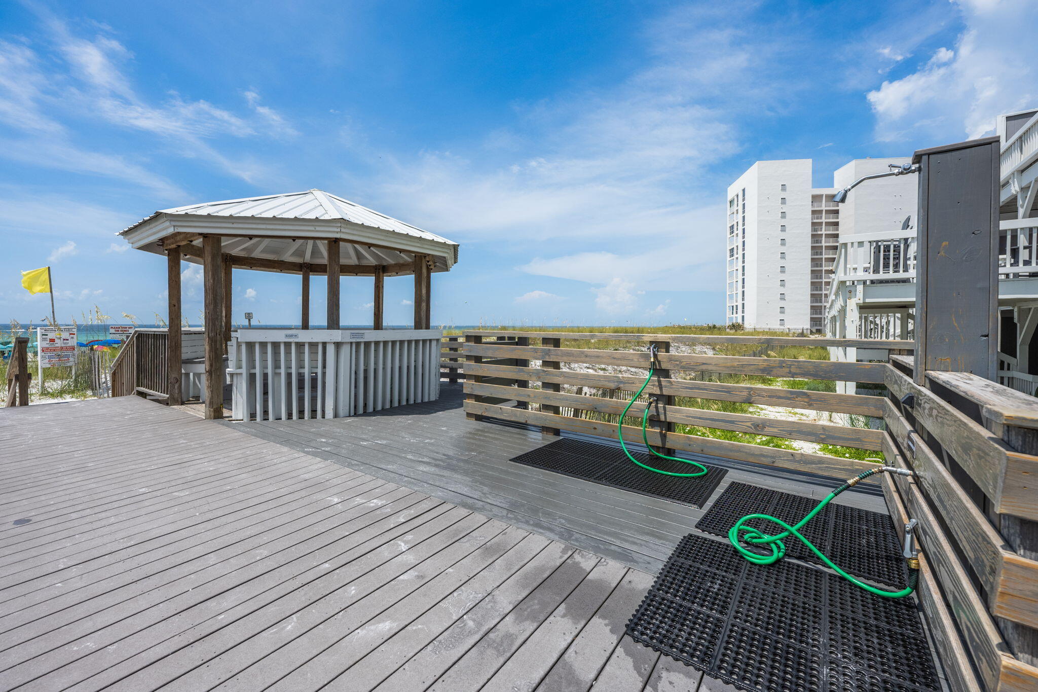 940 Highway 98, Unit 31 Destin, FL 32541 - Photo 35 of 36 a view of a roof deck with chair and wooden floor
