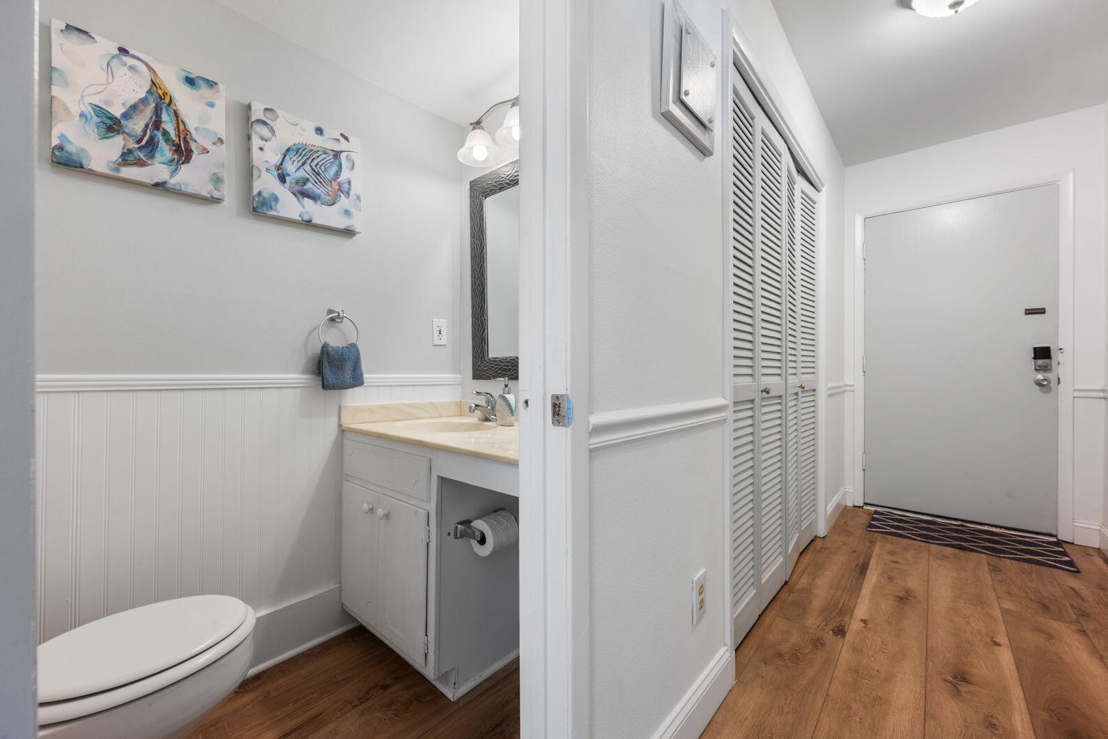 940 Highway 98, Unit 31 Destin, FL 32541 - Photo 4 of 36 a bathroom with a sink and a toilet
