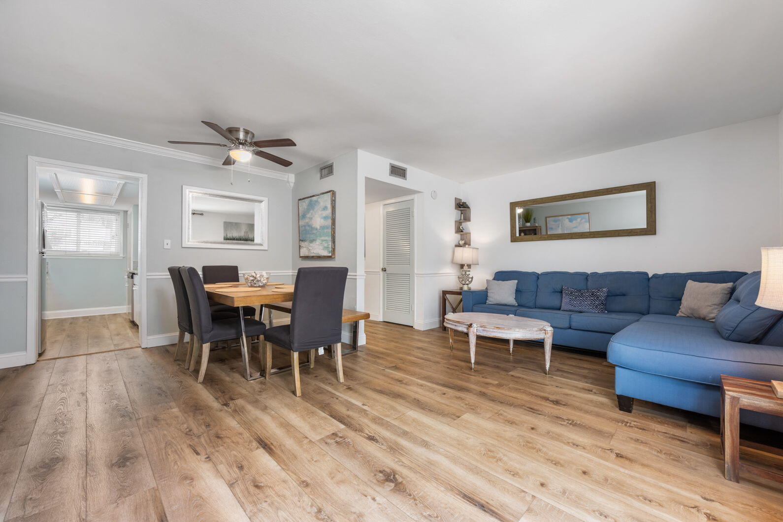 940 Highway 98, Unit 31 Destin, FL 32541 - Photo 7 of 36 a living room with furniture wooden floor and dining table