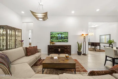 a living room with furniture a rug and a fireplace