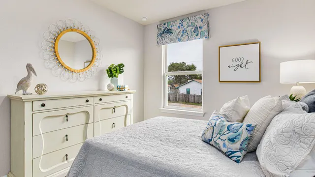 a bedroom with a bed and a dresser