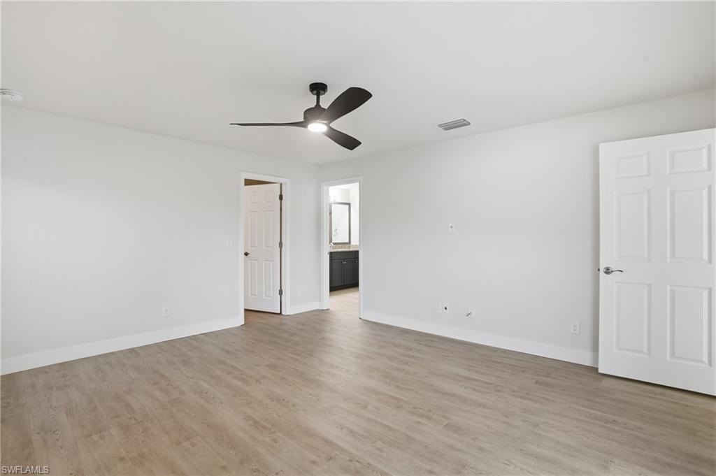 1808 Southwest 30th Street Cape Coral, FL 33914 - Photo 15 of 44 wooden floor in an empty room
