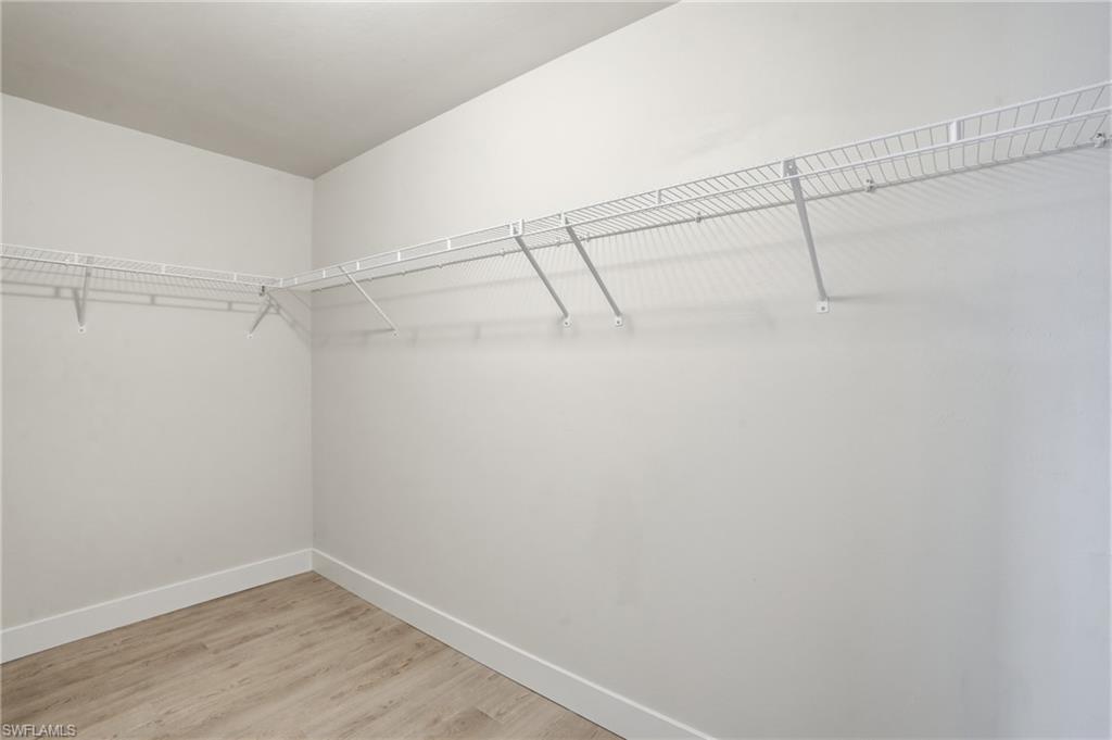 1808 Southwest 30th Street Cape Coral, FL 33914 - Photo 19 of 44 a view of a room with racks on the wall